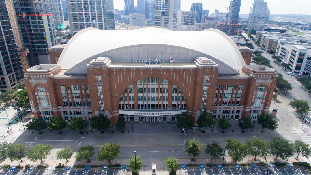 American Airlines Center and the downtown Dallas skyline — EMT Limo black car service
